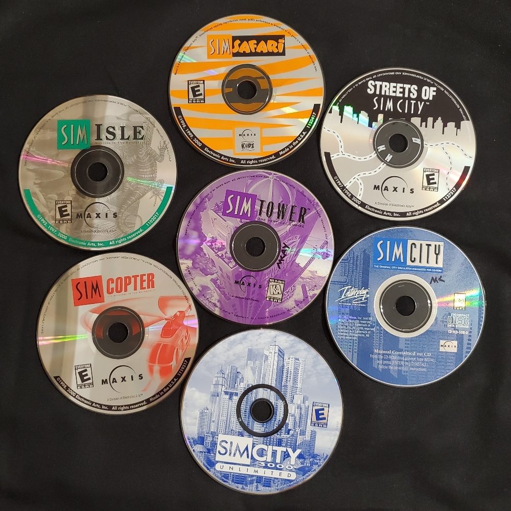 Lot of 7 'The Sims' related CD-ROM discs Vintage gaming no packaging